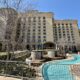 a building with a pool in front of it