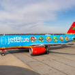 a blue airplane with cartoon characters on it