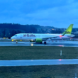 a white airplane on a runway