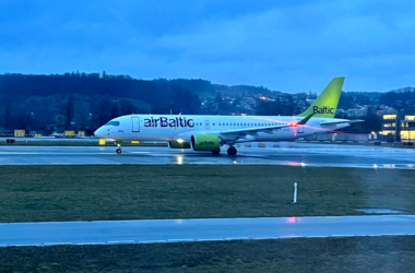 a white airplane on a runway