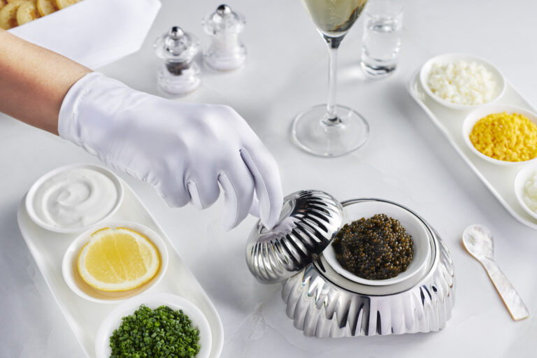 Emirates has made additional enhancements to First Class with white glove service in the air and a revamped check-in lounge in Dubai.