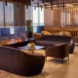 a room with couches and a fire