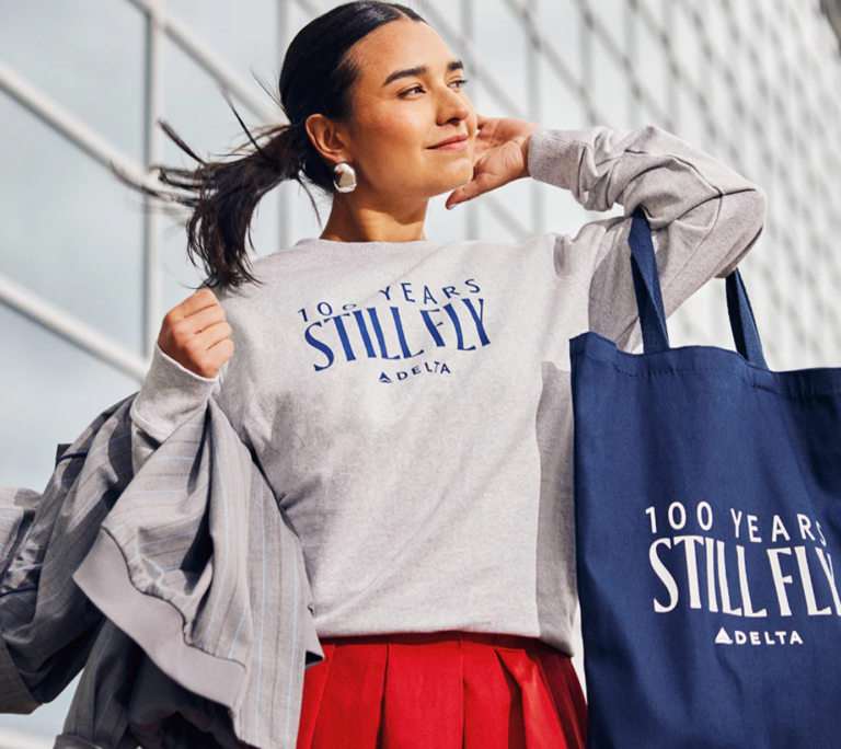 Delta Air Lines is celebrating its 100th anniversary with a new 'Still Fly' apparel collection on the carrier's online shop.
