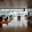 a room with chairs and a plane in the background
