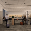 a group of people in a room with luggage