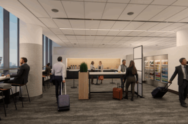 a group of people in a room with luggage