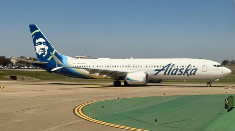 a white airplane on a runway