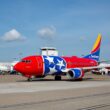 a red and blue airplane with stars on it