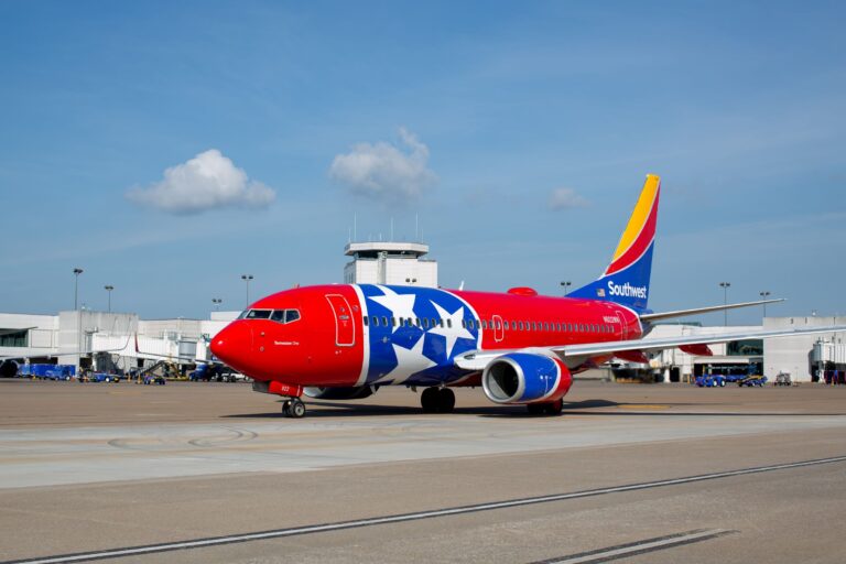 a red and blue airplane with stars on it