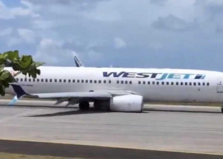 a white airplane on a runway