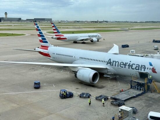 a group of airplanes on a runway