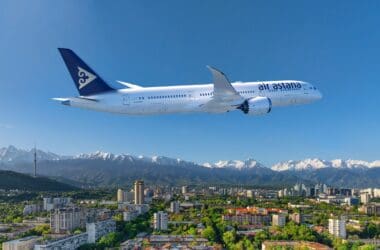 a plane flying over a city