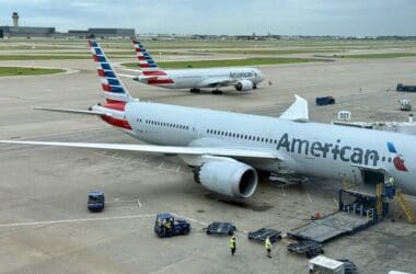 a group of airplanes on a runway