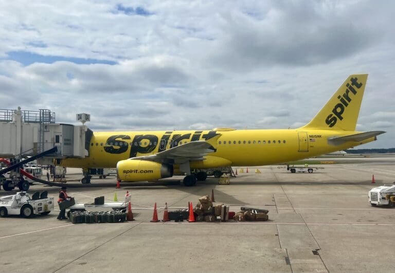a yellow airplane on a tarmac