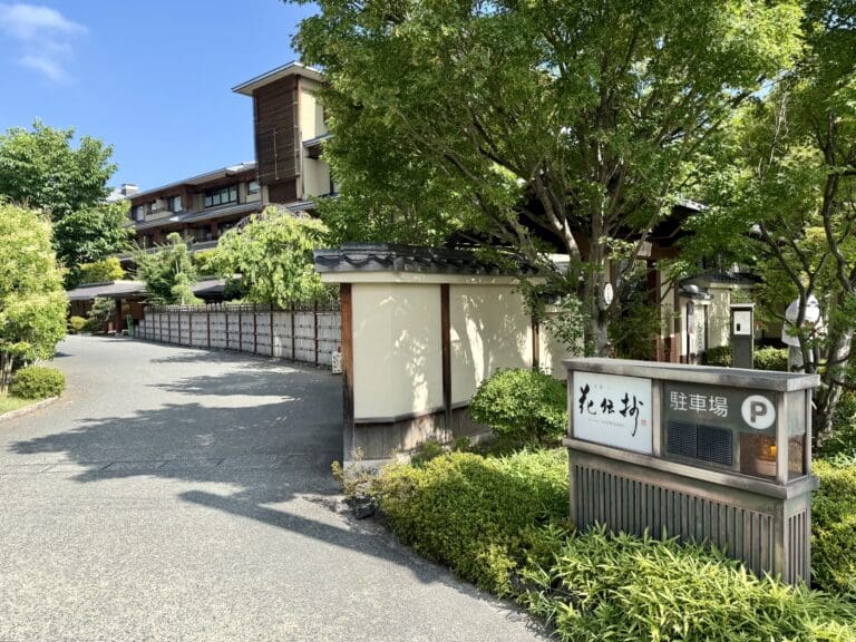 a road with trees and a building
