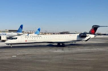 a white airplane on a runway