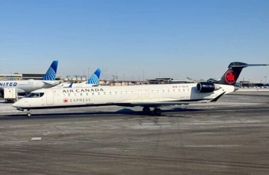 a white airplane on a runway